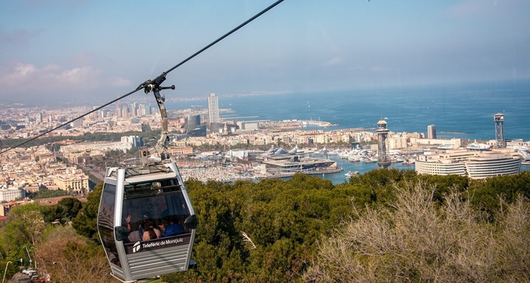 Barcelona-Montjuic-Cable-Car The Telefèric de Montjuïc Cable car ride to the top of Montjuic hill in Barcelona, on a summer's day