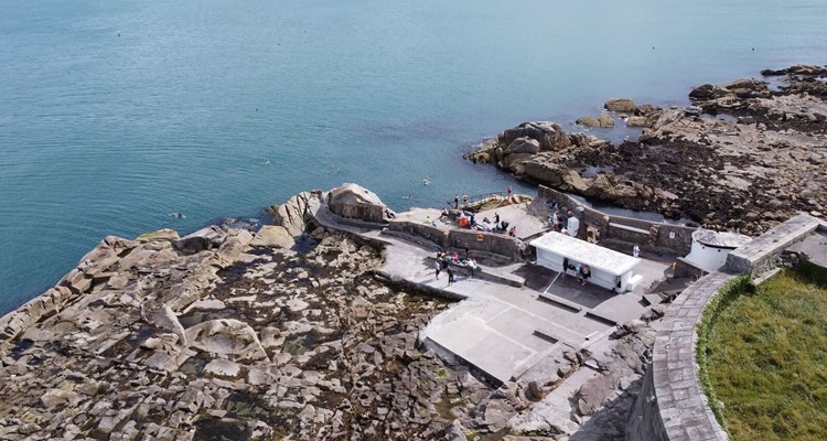 Dun-Laoghaire-Forty-Foot-Sandycove People jumping into the blue waters of the Irish Sea at Forty Foot near Sandycove in Dublin
